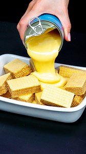 The famous dessert with waffles and condensed milk! No flour, no baking Ingredients chocolate flavored wafers: 200 g (7.1 oz) cheese cream: 400 g (14 oz) condensed milk: 200 g (7.1 oz) whipping cream: 250 ml (8.5 fl oz) lemon juice: 20 ml (0.7 fl oz) gelatine: 15 g (0.5 oz) water: 60 ml (2.0 fl oz) Additionally lemon: 3 pc sugar: 60 g (2.1 oz) water: 200 ml (6.8 fl oz) lemon: 2 slices | Cookrate