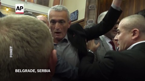 Scuffles erupt between ruling party and opposition lawmakers in Serbia’s parliament