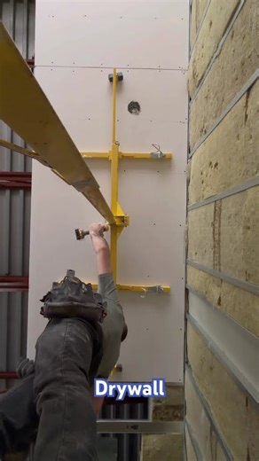 installing and securing drywall to the ceiling using a manual lift #constructionlife #drywalllife
