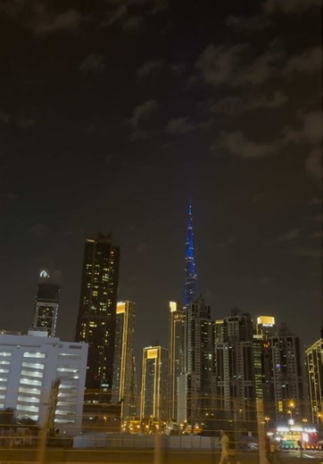 Part - 277 | Just a random winter night in Dubai ✨ Driving through Business Bay and this video pops up — a magical, glowing blue Burj Khalifa surrounded by golden lights. Cool weather, cloudy skies, and soft wind in the air. This is the best season to be in Dubai. This is the real Dubai vibe 💙 #DubaiNights #WinterInDubai #BusinessBay #BurjKhalifa #DubaiVibes