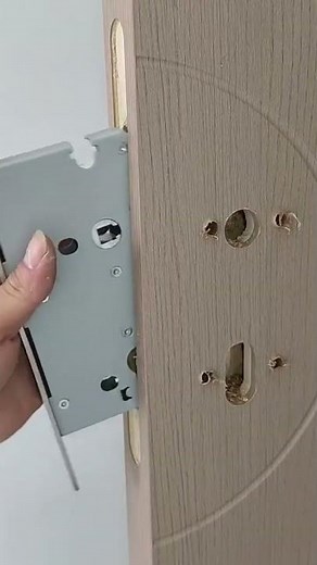 Use a drill to make holes according to the pattern for installing the handle and lock set. #homemade