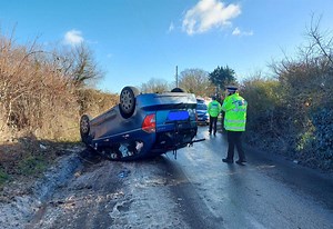 Lucky escape for driver as car flips on icy road