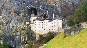 View of the Predjama Castle in Slovenia. Places of historic interest. The impregnable medieval marvel has been perched in the middle of a 123 meter high cliff for more than 800 years.