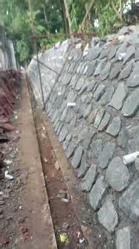 the process of installing stones on a slope#shorts