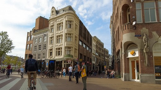 What do you notice while cycling Amsterdam?