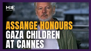 At the Cannes Film Festival, Julian Assange unbuttoned his shirt to reveal a a T-shirt listing the names of 4,986 Palestinian children aged five and under who were killed by Israeli forces since 2023. The gesture comes amid ongoing international concern over the humanitarian impact of Israel’s military operations in Gaza and the continued restrictions on the entry of humanitarian aid. | Middle East Eye