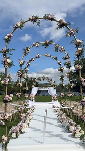 A fabulous Jewish wedding ceremony at Cameron House, with views of Loch Lomond. The bride and groom walked through a trio of exquisite floral arches, leading down the aisle to a softly draped chuppah adorned with cascading pastel florals - a scene of pure sophistication. @premierweddingsscotland @cameronhouselochlomond @sophiewhite_mua @louisehendersonhair @jaaaamieramsay @harperscottphoto @focasweddingfilms @ckhairx @rude_cookies @glasshouse_events_ltd @capellastringquartet @muzika_ltd @thephat