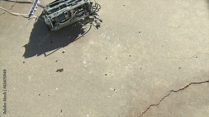 Typewriter Breaks. A typewriter being thrown onto concrete, breaks and rolls on impact. Shot in slow motion at 60fps.