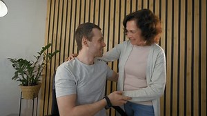 Two friends connect through a split screen video call, sharing personal updates and enjoying a relaxed conversation. The setting features home environments that enhance their connection.