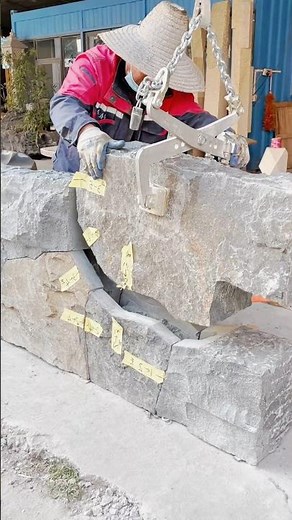 Dry-stacking stones to build walls