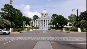 Dexter Avenue and Alabama State Capitol building and traffic in Montgomery, Alabama with stable video.