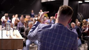 Male Speaker man seminar public on stage speaking talking business conference with presentations. People audience at hall, Conference, meeting, colleagues, team, training, corporate coaching concept