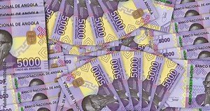 Angolan Kwanza banknotes in a cash fan mosaic pattern loop. Angola AOA 5000 money notes. Abstract concept of bank, finance, economy seamless and looped decorative design background.