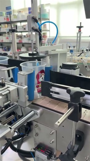 Automatic Round Container Labeling Machine in Action