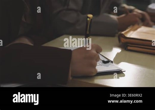 man writing on notebook Stock Video Footage - Alamy
