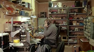Engineer repair of computer equipment at work in his old workshop Stock Video