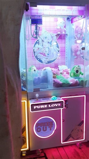 This is a claw machine at a village night market. Popular with kids and adults alike, but the machines mostly eat your money—rarely do you win a prize. A small, playful part of village market life. #fblifestyle | Vozie Daily