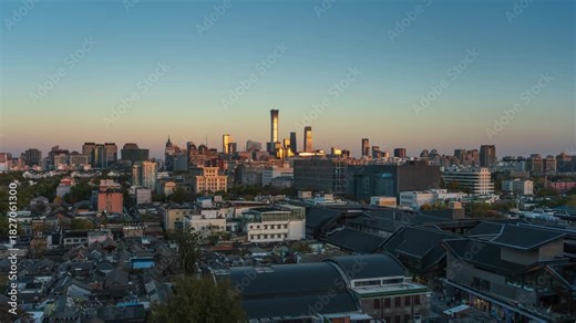 Time-lapse footage of Beijing, China, transitioning from day to night, showing hutongs to the central business district and the contrast between old and new city areas