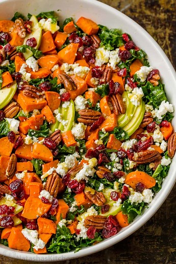 It’s loaded with roasted sweet potatoes, kale, crisp apple, and crunchy pecans with the best maple vinaigrette dressing! RECIPE: https://natashaskitchen.com/roasted-sweet-potato-salad/ | NatashasKitchen.com