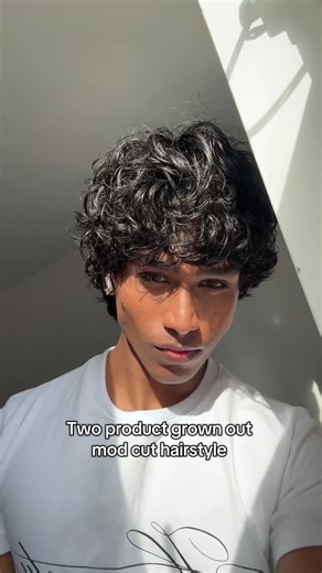 Two-product grown out mod cut hairstyle for men