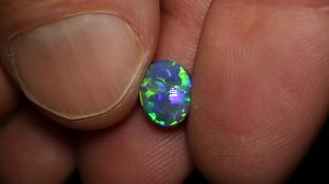 18K views · 574 reactions |  Green & Blue  An epic Lightning Ridge black opal showcasing vibrant green and blue play of color through a crisp flagstone pattern and high dome. The perfect gem for a ring setting. ✨️ 1.81ct gem black opal 8.7x7x4.6mm https://blackopaldirect.com/products/1-81-ct-gem-black-opal-8-7x7x4-6mm | Black Opal Direct | Facebook