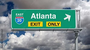 Atlanta Interstate 20 exit sign with time lapse clouds and zoom.