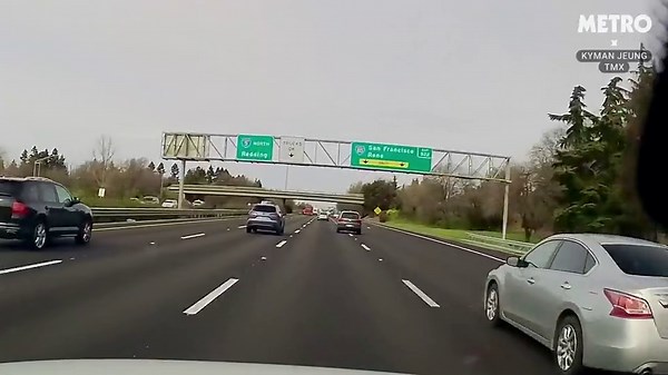 Car crashes onto highway from overpass