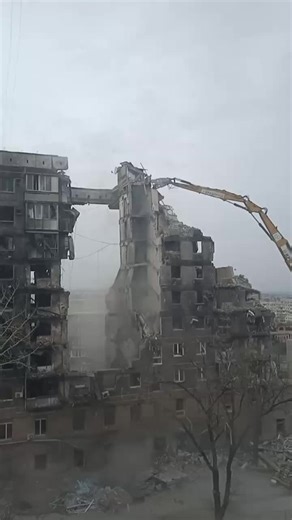 Concrete Building Demolition Process in Urban Environment