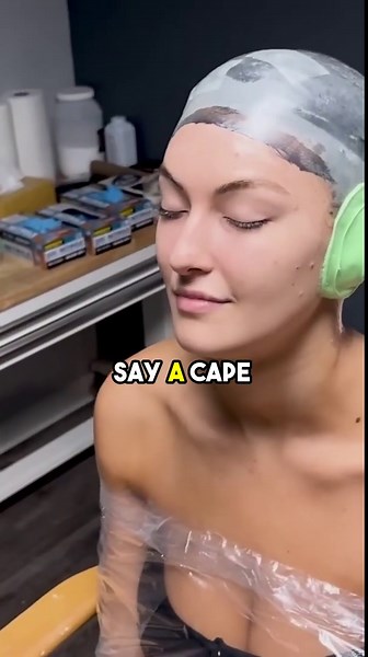 Watch this model decorate a cake on her head