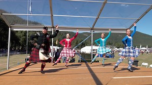 A soldier taking part in the Highland Fling, Scottish Highland dance adult heats, during the 2022 Ballater Highland Games. These were held at Ballater in Deeside, Aberdeenshire, Scotland on Thursday 11th August 2022. Sadly we don't know where he placed, but on the front row with him wearing blue is champion Highland dancer Rachel Walker from Fettercairn. During the summer Balaklava Company, The Royal Regiment of Scotland (The Argyll & Sutherland Highlanders) known as 5 SCOTS, are stationed in Ba