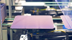 Innovative production concept. Solar module plates being discharged and moving along the conveyor