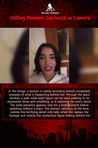 📣 Chilling Moment Captured on Camera In the image, a woman is calmly recording herself, completely unaware of what is happening behind her. Through the glass window, a pale, wide-eyed figure can be seen peeking in, its expression tense and unsettling, as if watching her every move. The eerie presence appears only for a brief moment before vanishing without a trace. The woman, oblivious at the time, realizes the terrifying detail only later when she replays the footage and notices the mysterious