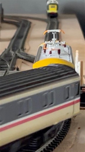 Class 87 speeds through Benchester crossing with sleeper service