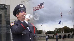 Bugler plays Taps at the Huntsville Madison County Veterans Memorial