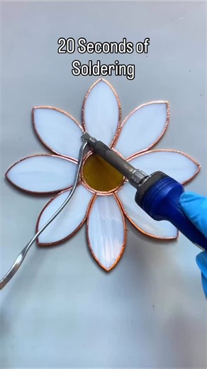1.5K views · 1.3K reactions | The magic of soldering is that you can redo any areas you aren’t happy with to get a nice smooth finish. I always try and move through the junctions as I find it gives me a more consistent solder line. I forgot to film doing the edges (as always!) as it involves some more tricky camera angles. #stainedglass #daisy #commissionart #oxfordart | Craics Glass | Facebook