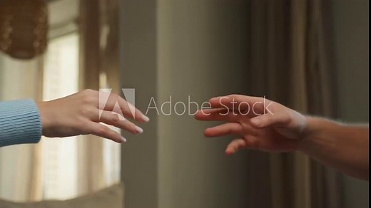 The hands of a man and a woman reach out and touch each other with love in the room. valentine's day. The concept of human relations.