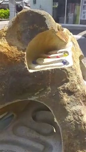 Amazing entertainment of marbles rolling down carved stone path