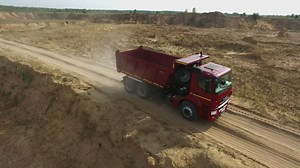 Red truck heading to a quarry - Free Stock Video