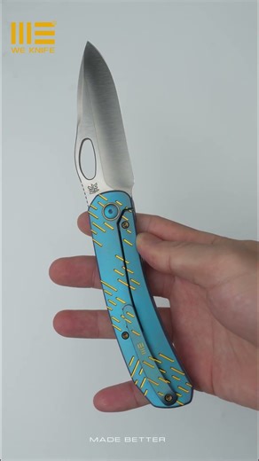 The WE Inmate with blue titanium handle with golden raindrop texturing and a satin CPM-20CV blade.