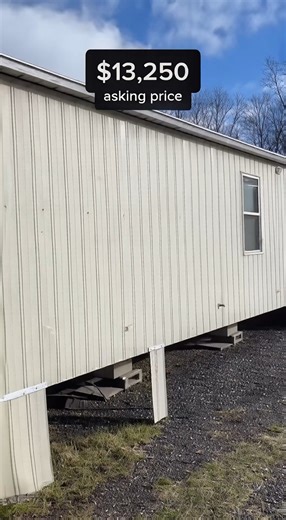 used mobile home priced at $13,250. When you look at the home, from the outside you can see that it is old. The home shows its age.. The structure of the home is good. It sits straight. It is level. Inside the home the flooring is firm when you walk on it. The way the home is laid out is nice. The rooms go from the front to the back of the home. This makes it easy to move inside the home. It is easier to move than you might think it would be. The kitchen is one of the things you see when you wal