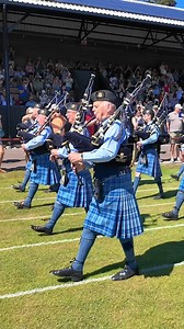 Pipe Major Barry Ashby leads RAF Lossiemouth Pipes and Drums, as they marched on playing Battle of the Somme during the 2025 Inverness Highland Games. These were held at Bught Park in the City of Inverness on Saturday 12th July 2025, and the band, wearing their Royal Air Force tartan, then played the Heights of Dargai as they marched in front of the covered stands. #inverness #invernesshighlandgames #pipesanddrums #raflossiemouth | Scottish Highlands & Inverness