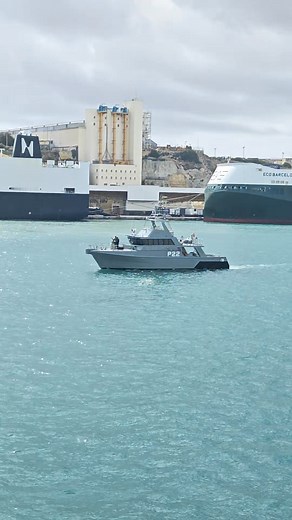 Spotted this patrol boat making its rounds at the harbor today. There's something fascinating about watching these maritime security teams at work while the entire port buzzes with activity behind them - trucks loading containers, cargo moving in and out, the whole operation running like clockwork. We don't often think about the people who keep our harbors safe and our supply chains moving, but moments like this remind me of how much coordination and dedication goes into it all. Every boat, ever