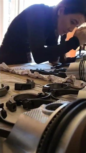 Installing the little springy lock thingies in the pistons