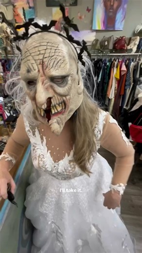 HELP!!😭 the real Bridezilla is here for a wedding dress!! We think we found her the perfect one for a reasonable price🤷‍♀️ how does she look??🧟‍♀️Everybody say congratulations to this beautiful bride😰🥴#consignmentshop #skitcomedy #bridezilla #dressboutique #funnyviral #halloween #ghostbride #halloweenbride #halloweencostume #halloween2025 #funnyviral #halloweenfunny @#thriftstore | Play it Again Val