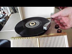 Firestone record player playing a 16 RPM record.