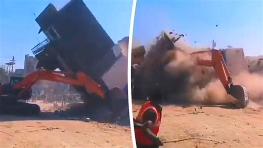Three-story building collapses onto excavator during demolition in India