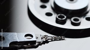 Detail of computer hard disk drive spin up and head movement. Shot in 4K UHD