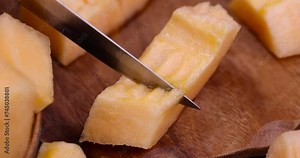 sliced orange melon close-up, delicious soft and ripe food melon on the table