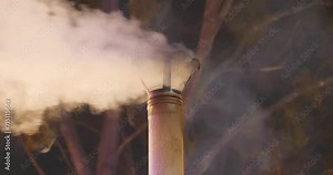 Stove pipe. Smoking chimney. Smoke and carbon dioxide emissions from chimney because of burning wood, exhaust gas emissions, atmospheric pollution, problem of global warming and climate change