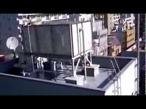 Water Tank Overflow ビル屋上貯水タンク（高架水槽）のオーバーフロー管からあふれ出る水